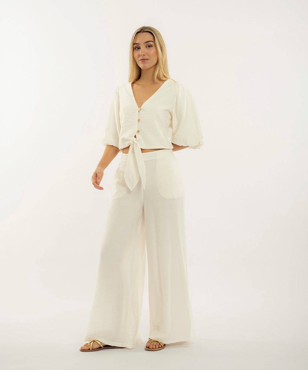 Pantalón con elástico MARFIL 0AT1144500006-2 para mujer, estilo casual con pierna ancha y bolsillos frontales, ideal para looks veraniegos.